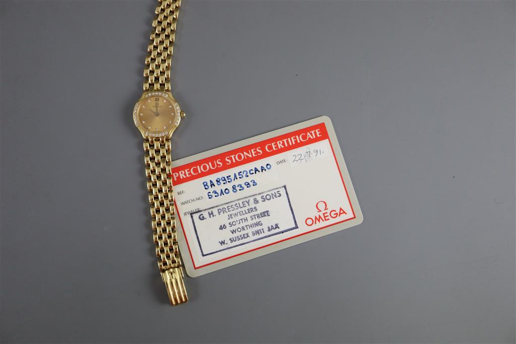 A ladys 18ct. gold Omega quartz wrist watch with diamond set bezel and numerals,